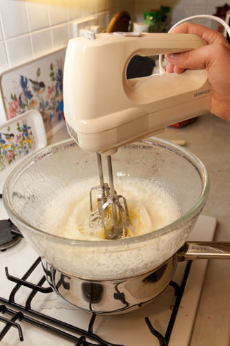 Whisking the lemon frosting